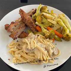 A picture of Carbonara Pasta with Grilled Lamb Ribs.