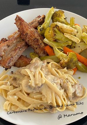 A picture of Carbonara Pasta with Grilled Lamb Ribs.