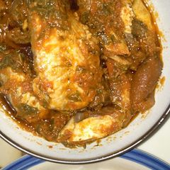 A picture of Spinach stew with smoked fish and pomo (cowskin).