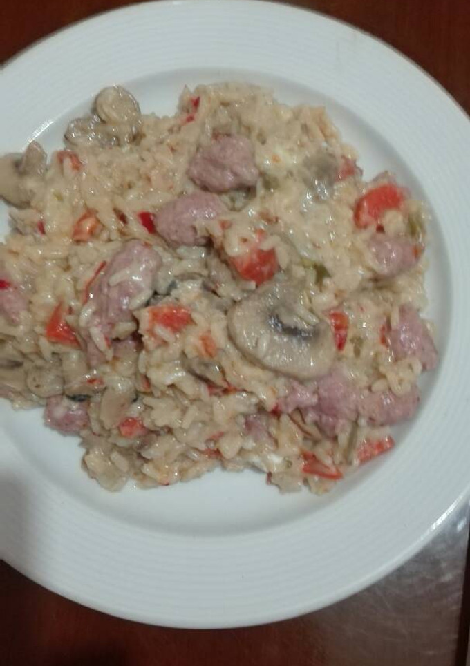 Una foto de Risoto de longaniza fresca y champiñones naturales