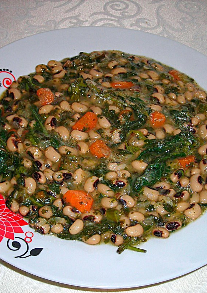 Una foto de Guiso de alubias careta con ortigas - veggie