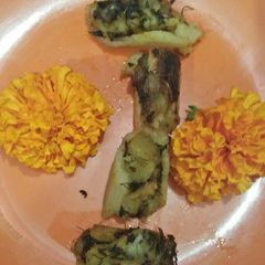 A picture of Methi alloo stuffed lotus stem.