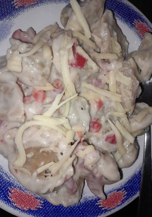 Una foto de Tortelines relleno de espinaca y panceta