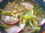 Una foto de pozole verde