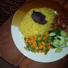 A picture of Curry rice with vegetables.