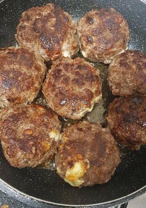 A picture of Cheese stuffed burgers.