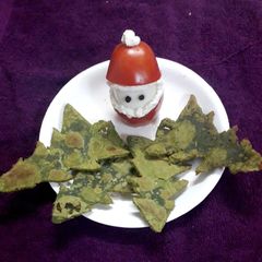 A picture of Tomato santa with spinach Christmas trees.