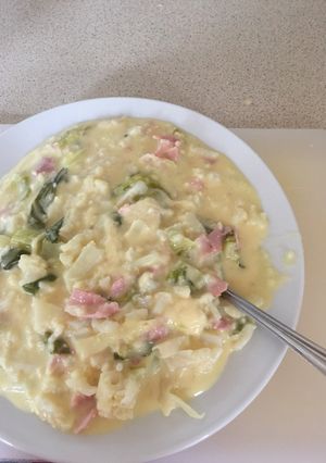 A picture of Cauliflower Cheese with Bacon bits.