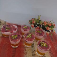 A picture of Fruit custard with grapes sauce and jelly.