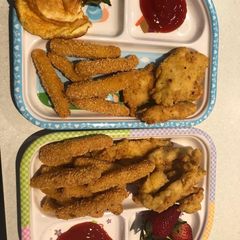 A picture of Breaded chicken breast/fried egg and fries.
