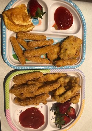 A picture of Breaded chicken breast/fried egg and fries.