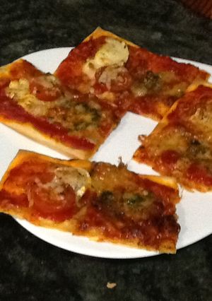 Una foto de Pizza sabrosa dos quesos