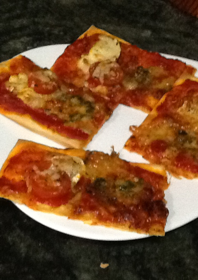 Una foto de Pizza sabrosa dos quesos
