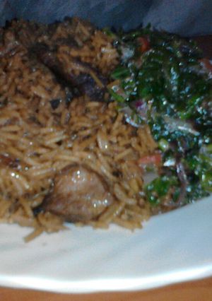A picture of Pilau with greens.