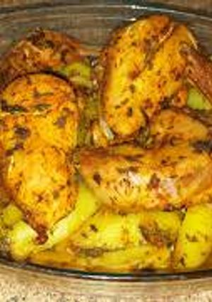 Una foto de Receta de pollo mararinado con patatas al horno