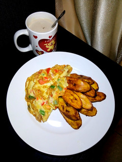 A picture of Veggies Omlette & fried plantain.