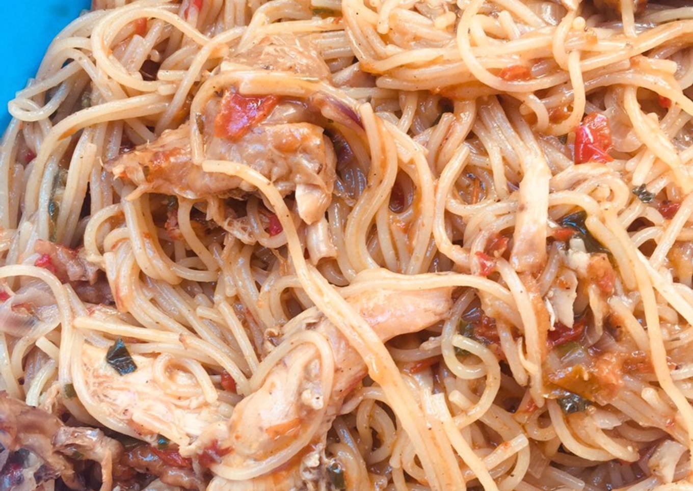 Spaghetti jollof with shredded chicken