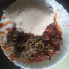 A picture of Wet fry liver served with ugali.