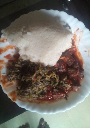 A picture of Wet fry liver served with ugali.