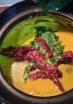 A picture of Raw mango,drumstick,coconut curry..mom’s recipe.