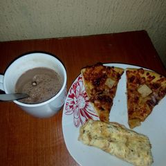 Fried eggs,left over Pizza and Hot Choco A picture of Fried eggs,left over Pizza and Hot Choco.