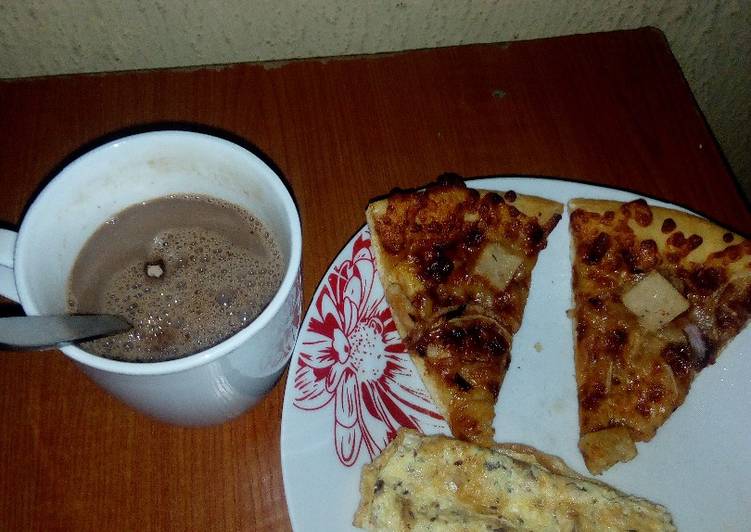 Fried eggs,left over Pizza and Hot Choco