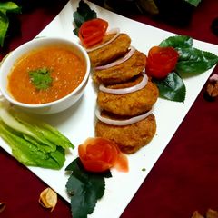 A picture of Beef Shami Kabab and Tamater ki chutney,.