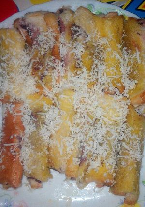 Foto resep Roti Tawar Gulung Isi Selai Blueberry Dg Pisang Toping Keju
