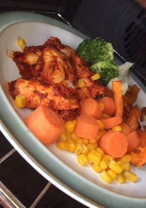 A picture of Tomato & Mustard Sticky Chicken with Sweet Potato Fries & Veg.