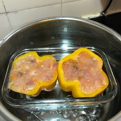 A picture of Steamed stuffed capsicum with fresh mushroom, pumpkin, asparagus, potatoes, fish, pork and egg white.