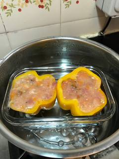 A picture of Steamed stuffed capsicum with fresh mushroom, pumpkin, asparagus, potatoes, fish, pork and egg white.