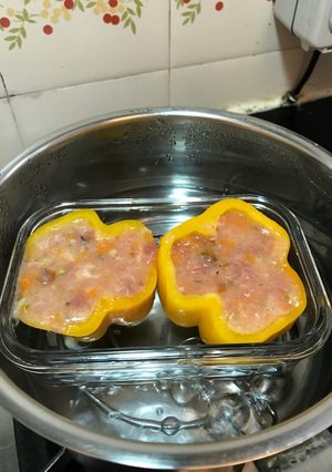 A picture of Steamed stuffed capsicum with fresh mushroom, pumpkin, asparagus, potatoes, fish, pork and egg white.