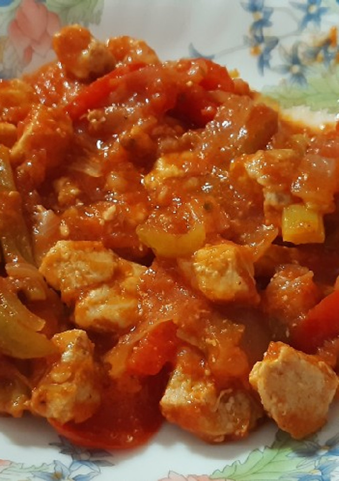Una foto de Lomo de cerdo con tomate