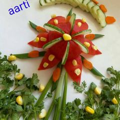 A picture of Tomato lotus flower salad.