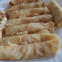 A picture of Pancakes roll with cream.