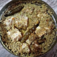 A picture of Steamed Paneer in Mustard Sauce.