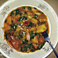 A picture of Yam Porridge with Spinach leaves. Step-by step Recipe.
