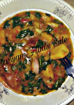 A picture of Yam Porridge with Spinach leaves. Step-by step Recipe.