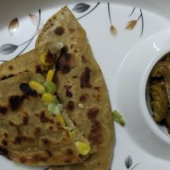 A picture of Corn cheese stuff pratha.