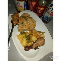 A picture of Teriyaki rice with stir fried potatoes.