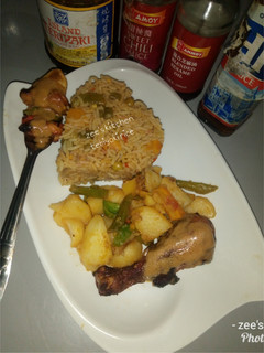 A picture of Teriyaki rice with stir fried potatoes.