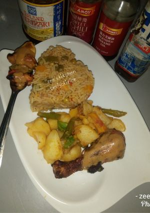 A picture of Teriyaki rice with stir fried potatoes.