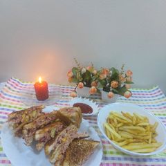 A picture of Chicken grilled cheese sandwiches 🥪with French fries.