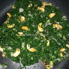 A picture of Sauteed Sukuma Wiki with Toasted Cashew Nuts.