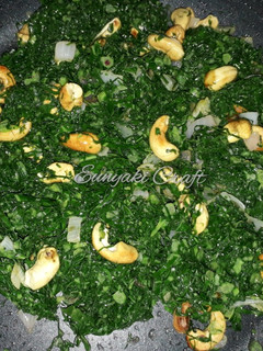 A picture of Sauteed Sukuma Wiki with Toasted Cashew Nuts.