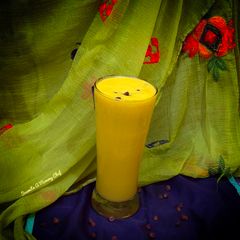 A picture of Mango banana smoothie with coconut milk.