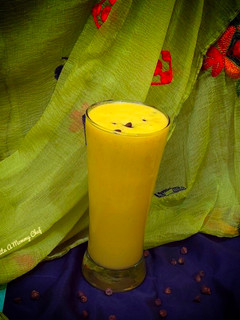 A picture of Mango banana smoothie with coconut milk.