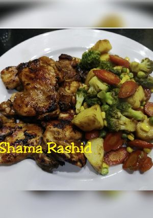 A picture of Chicken steak & stir fry vegetables.