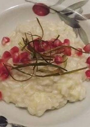 Foto di Risotto con brie, crema di porri e melograno