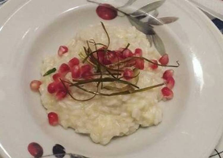 Risotto con brie, crema di porri e melograno